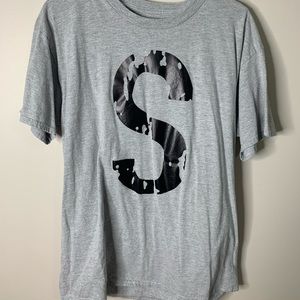 Iconic “S” t-shirt.
